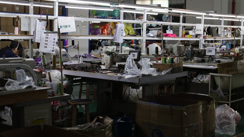 Sorting and packing bulk lanyards by attendee category with labeled cartons for event operations