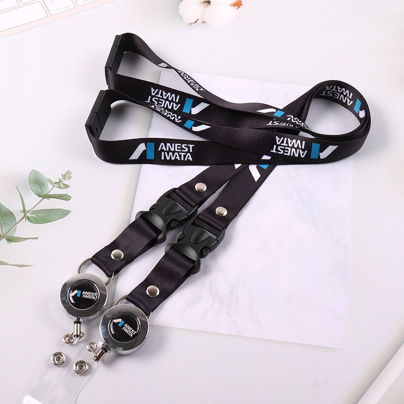 Custom logo heat-transfer lanyard in black with quick-release buckle and round badge reel