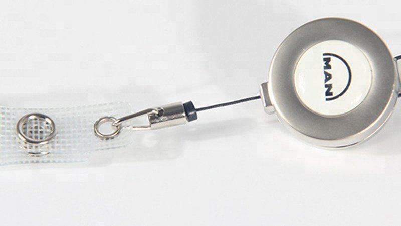 Lanyard clips and a retractable badge reel used to hold and scan ID badges at workplaces and events.