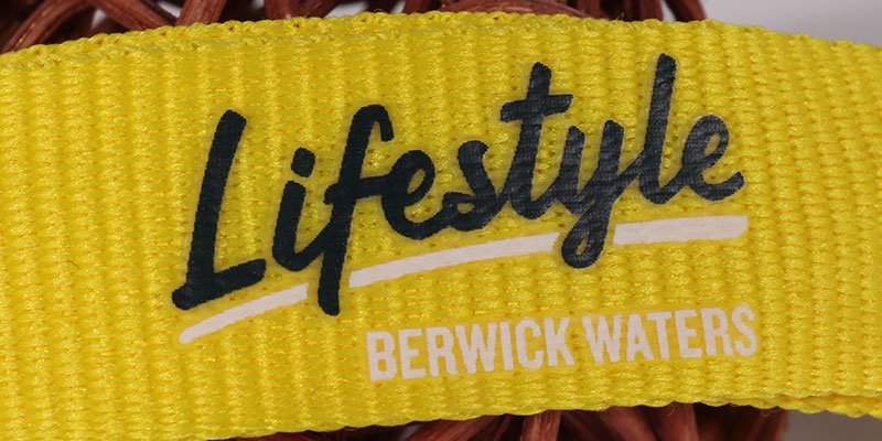 Close-up of silk screen printed logo on polyester lanyard