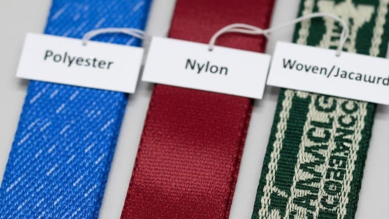 Lanyard material comparison for trade shows: polyester vs nylon vs woven jacquard for custom logo lanyards