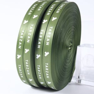 Screen printed polyester webbing with repeating logo pattern, high-quality woven strap material