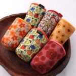 Custom printed neoprene coffee cup sleeves with colorful all-over patterns