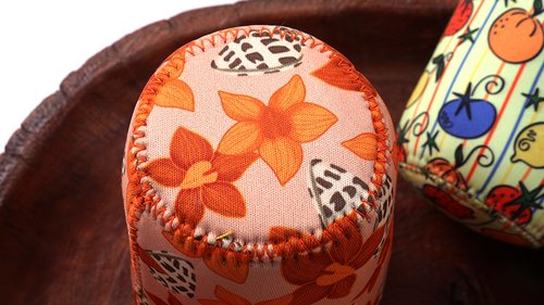 Close-up of neat bottom stitching on a custom neoprene coffee cup sleeve