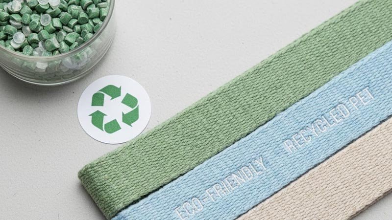 Recycled PET material and webbing close-up representing responsible material choices for merchandise