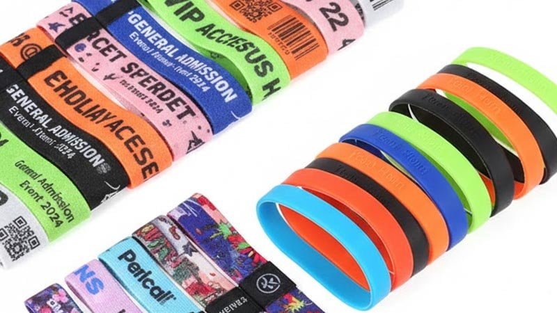 Different types of custom event wristbands including fabric silicone and Tyvek