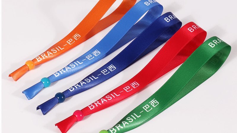 Color coded event wristbands for corporate branding and attendee management