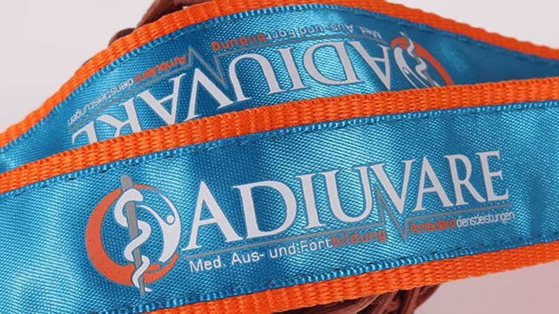 Close-up of a screen printed logo on a polyester lanyard showing crisp solid-color edges