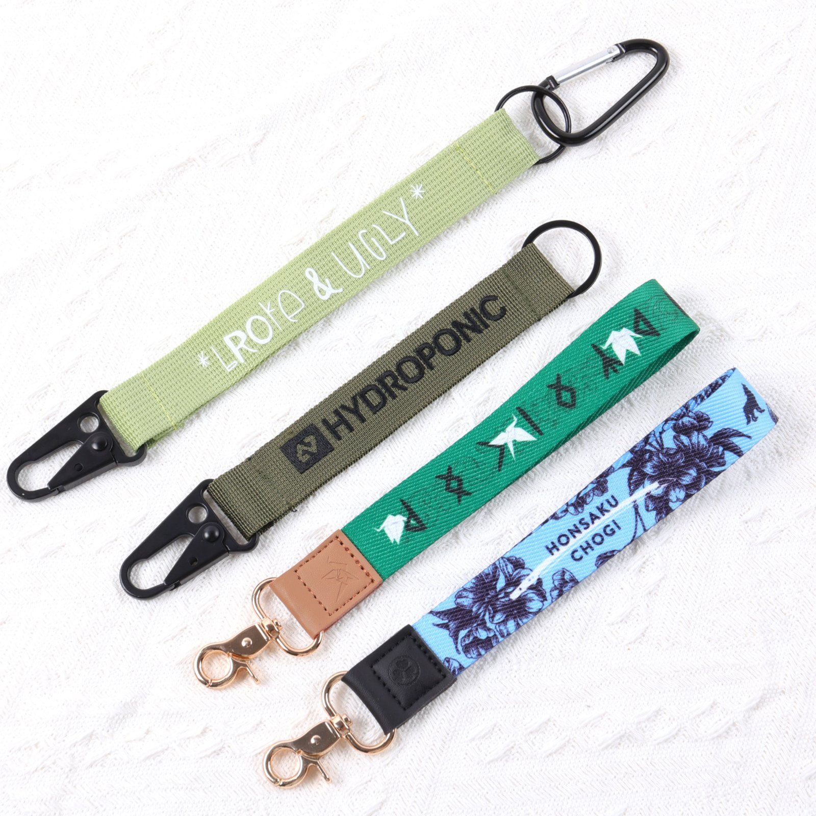 Branded wristlet short strap for keys and bags with metal hook attachment