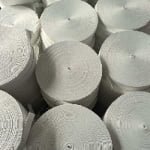 White satin ribbon made from 100% polyester with smooth glossy finish for gift packaging