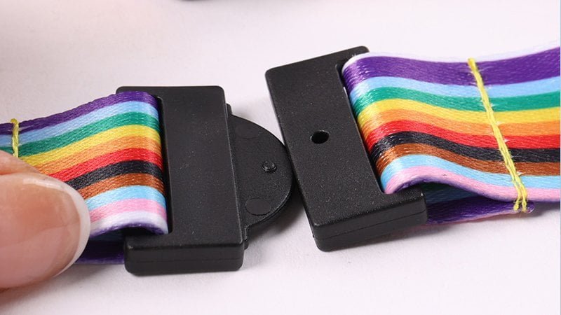 Close-up of a breakaway lanyard clasp opening under tension