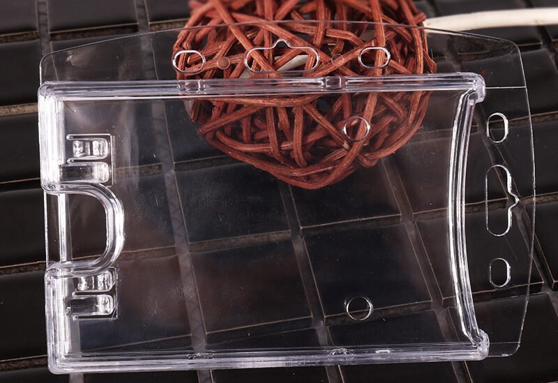 Transparent rigid plastic badge holder for employee ID cards