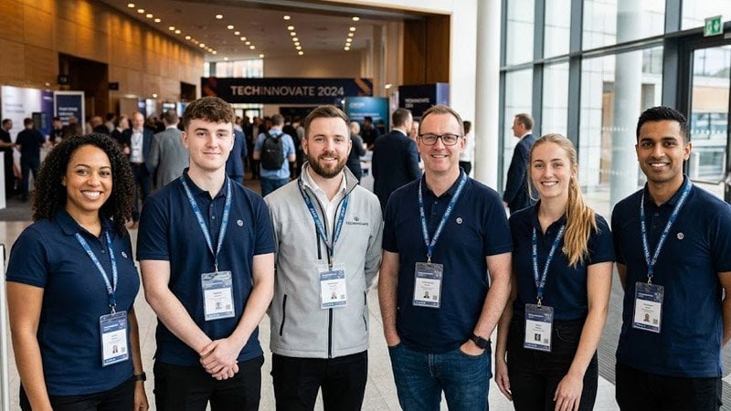 Employees wearing matching branded lanyards for visual consistency and brand recognition