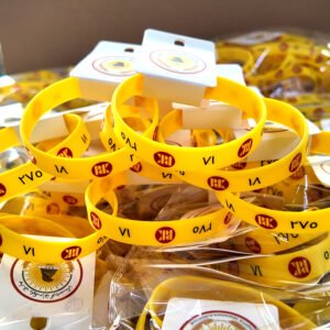 Custom silicone wristbands with printed logo and product hang tags, ideal for events, giveaways, and promotions