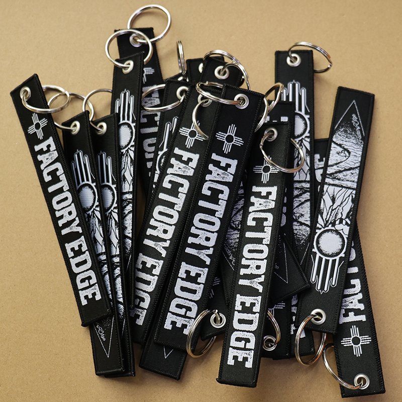 colorful embroidered keychain tags with woven logo branding design