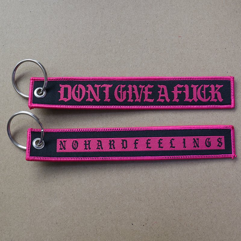 bulk custom woven keychains with embroidery detail and metal key ring