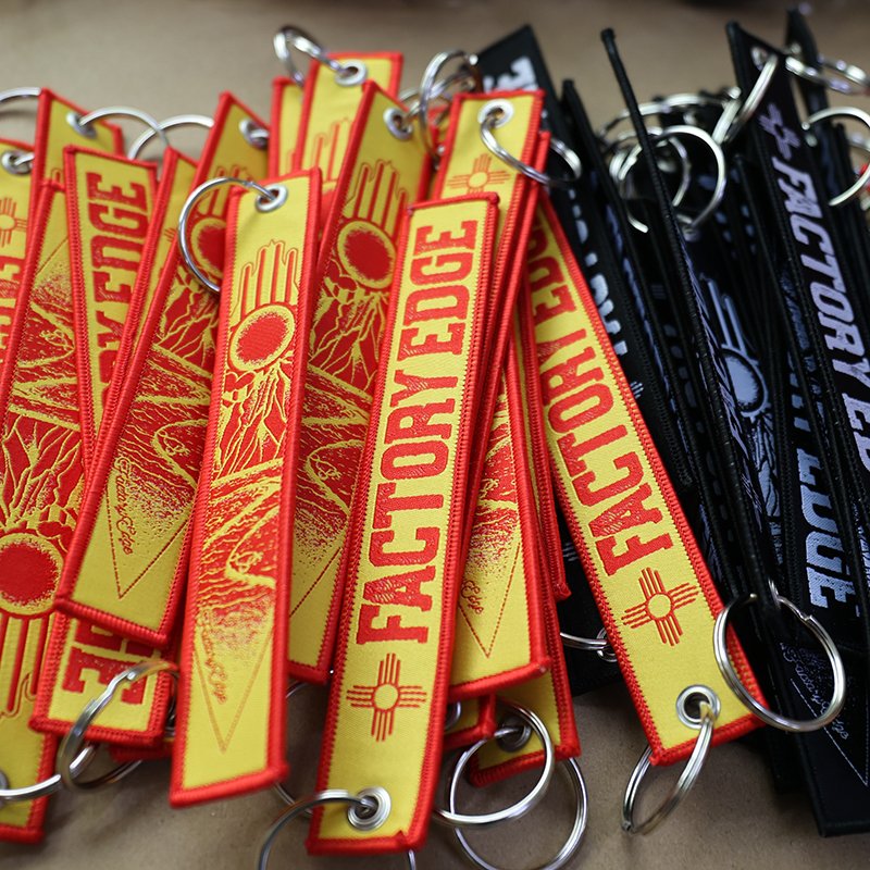 promotional embroidered keychain with reinforced stitching and metal ring