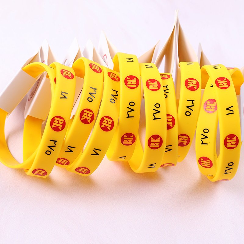 Personalized silicone wristbands with heat transfer printing and custom hang tags, perfect for branding