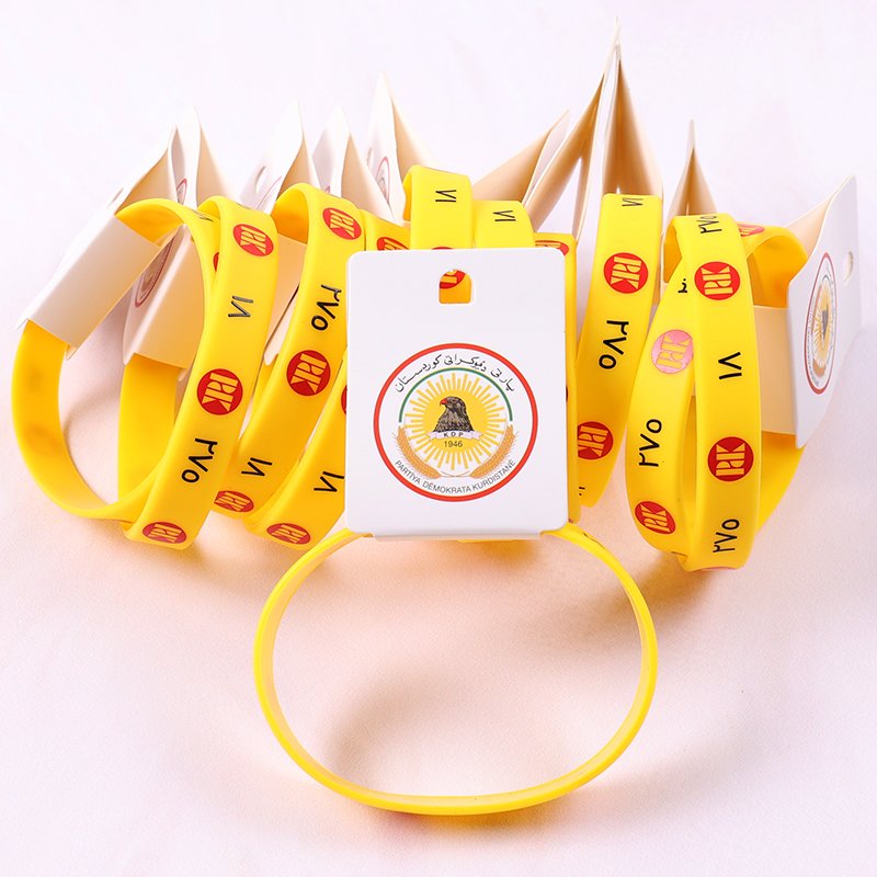 Silicone wristbands with vibrant logo design and product hang tags, available in custom colors and sizes