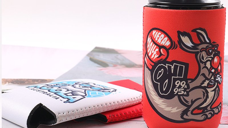 Collapsible stubby holders shown in folded and expanded form for easy storage and distribution