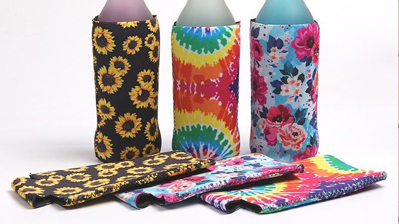 Custom slim can stubby holders fitted on tall beverage cans for modern drink packaging