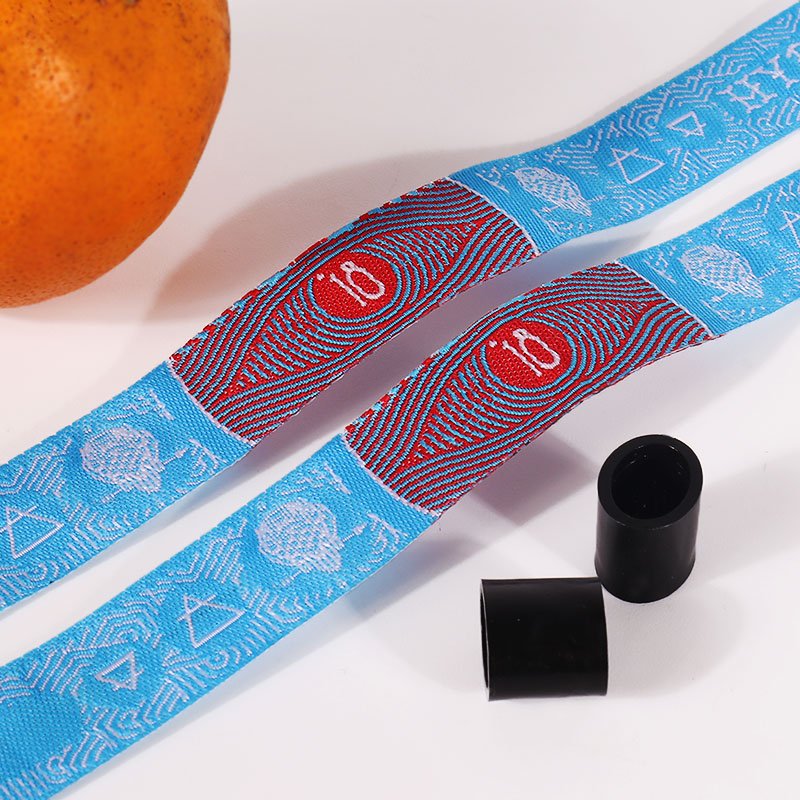 embroidered fabric wristband close view showing detailed texture