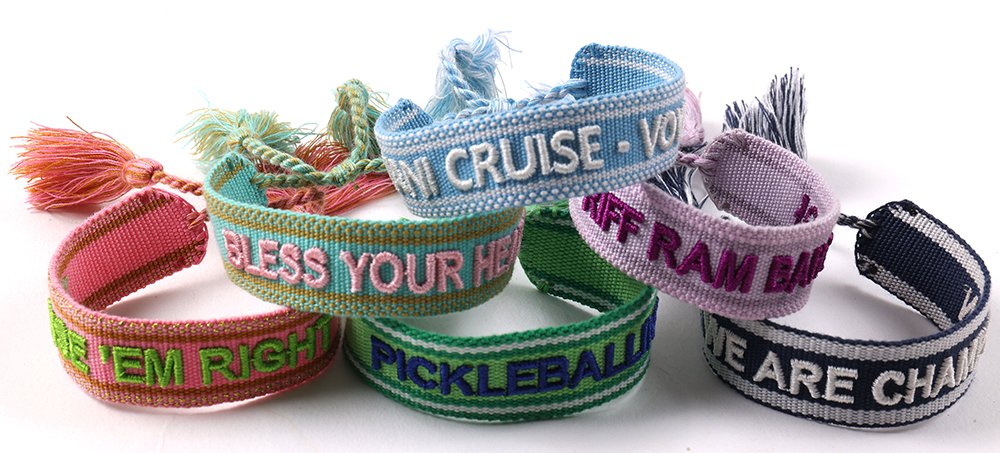 Personalized embroidered name bracelets with custom words and colorful tassels