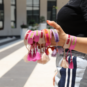 Custom embroidered friendship bracelets with personalized words and colorful tassels