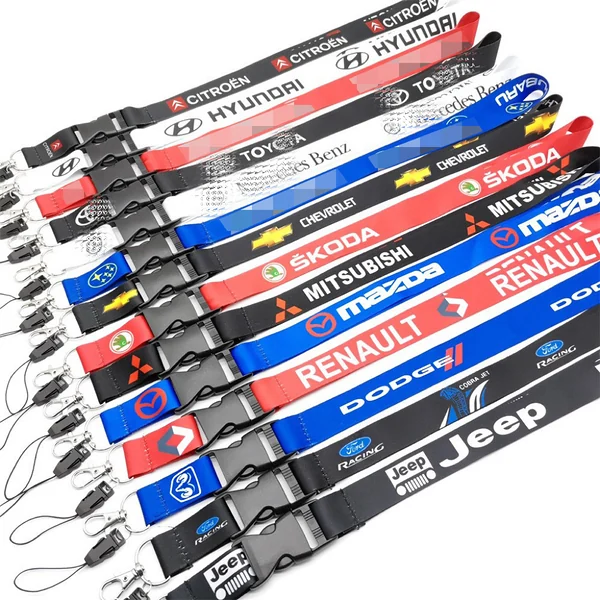 Large assortment of colorful custom automotive logo lanyards arranged in rows with black detachable buckles and metal hooks
