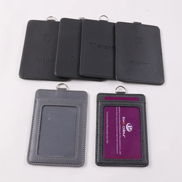Black and gray vertical card holders showing solid backs, a clear front window and card slots.