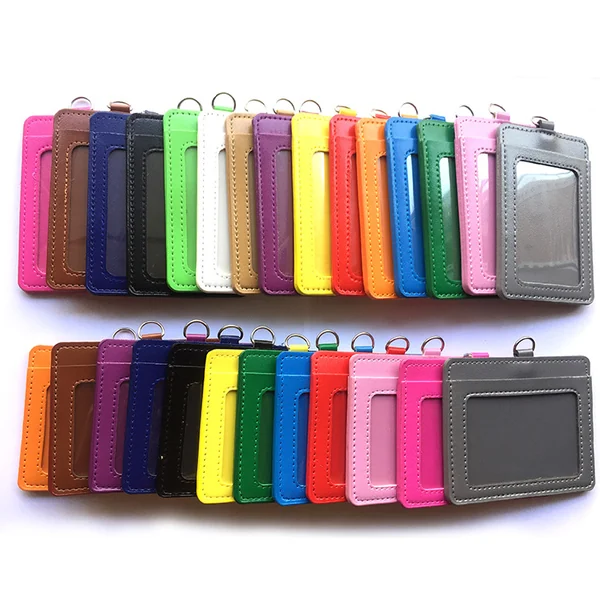 Two rows of colorful vertical ID card holders with metal attachment rings on a white background.