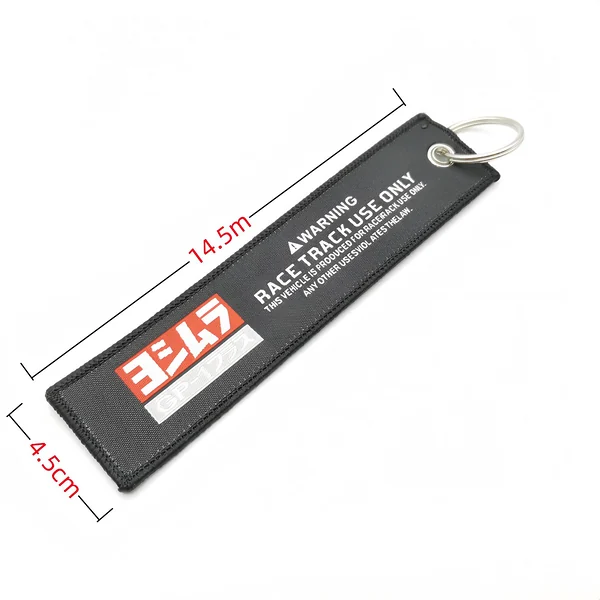 Black embroidered motorcycle key tag dimension image showing approximately 14.5 cm length and 4.5 cm width
