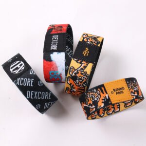 Custom branded elastic wristbands with black orange and graphic patterns