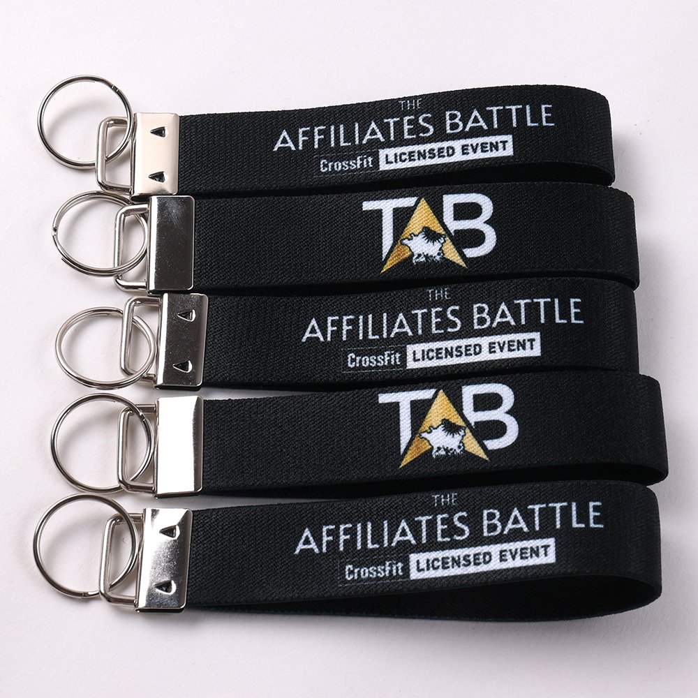 Custom black short key straps with branded logo panels, metal clips and key rings