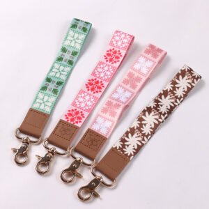 Pastel sublimation wristlet keychains with printed patterns, leather connectors and metal lobster clasps