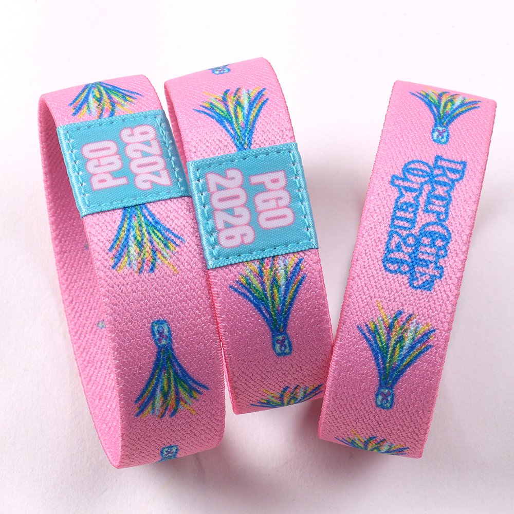 Pink custom NFC elastic wristbands with full-color event artwork