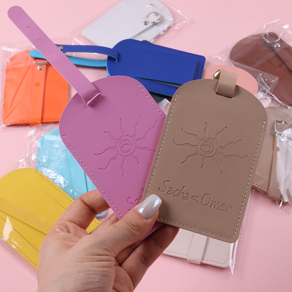 Pastel pink, blue, purple, brown and yellow embossed custom luggage tags