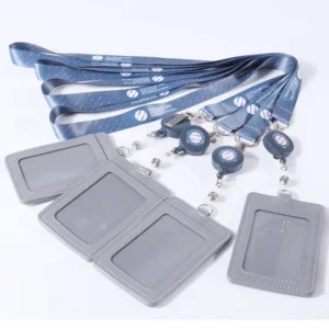 Gray vertical ID card holders arranged with blue printed lanyards and matching retractable badge reels.