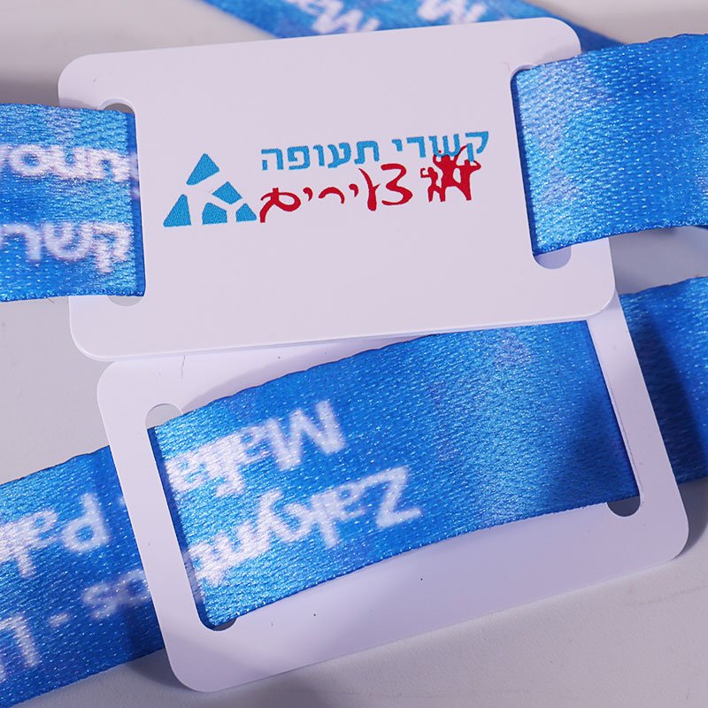 Close-up of custom RFID tag attached to a blue fabric wristband