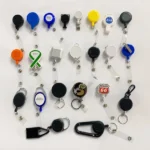 Sample board showing round and shaped logo badge reels, straps and carabiner styles