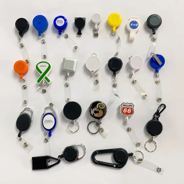 Sample board showing round and shaped logo badge reels, straps and carabiner styles