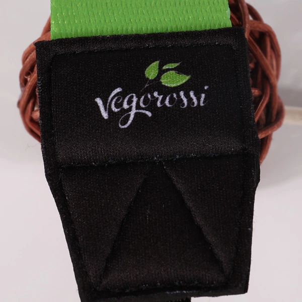 Close-up of a green strap and black stitched reinforced end with Vigorosi lettering