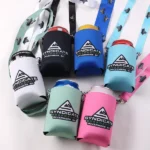 Six can coolers holding beverage cans with printed lanyards and metal attachment clips