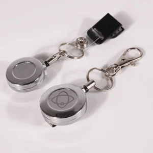 Silver round badge reels with key rings, swivel hook and black strap attachment