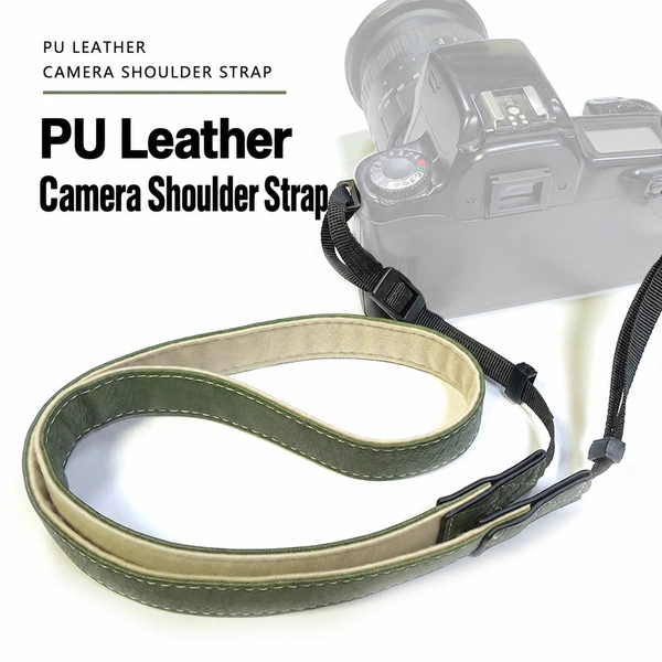 Olive green camera shoulder strap with cream lining, edge stitching and black adjustable attachment webbing