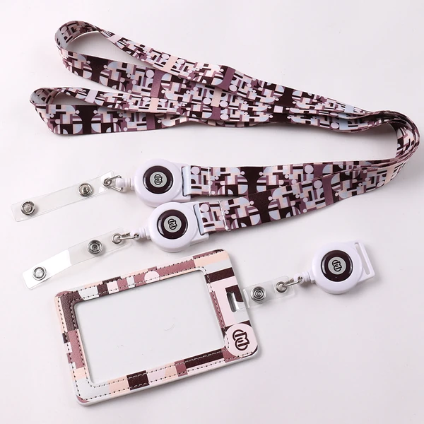 Patterned lanyard set with square logo badge reels and a matching ID card holder