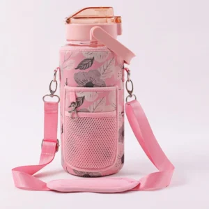Pink leaf patterned bottle carrier holding a pink water bottle with a mesh front pocket and matching shoulder strap