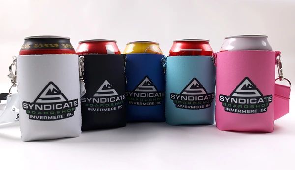Five logo printed can coolers in white, black, blue, turquoise and pink holding beverage cans