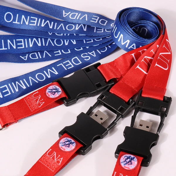 Close-up of red and blue printed lanyards displaying black detachable buckles and exposed USB plugs