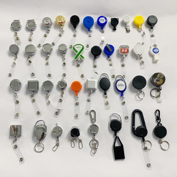 Display board of retractable badge reels in multiple shapes, colors and attachment styles